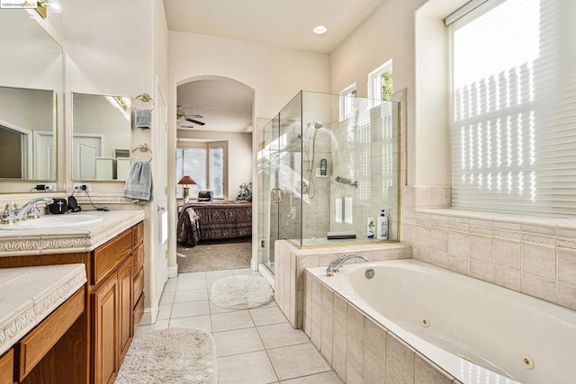 bathroom featuring ceiling fan, tile patterned floors, vanity, and shower with separate bathtub