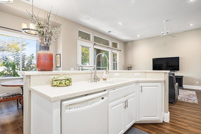 kitchen featuring sink, dark wood-type flooring, dishwasher, white cabinets, and ceiling fan with notable chandelier