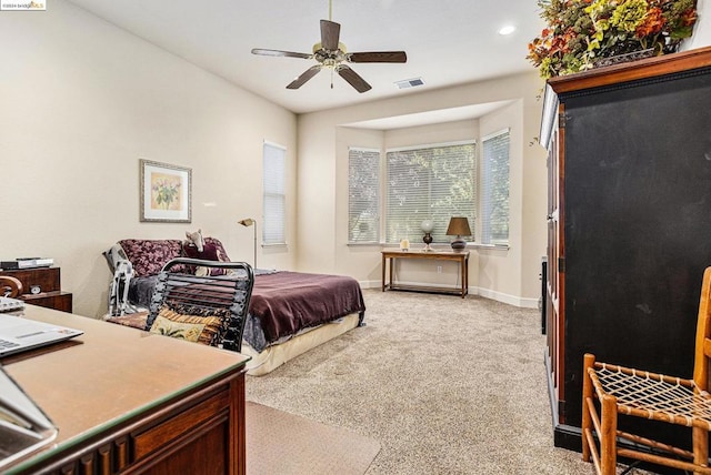 bedroom featuring light colored carpet and ceiling fan