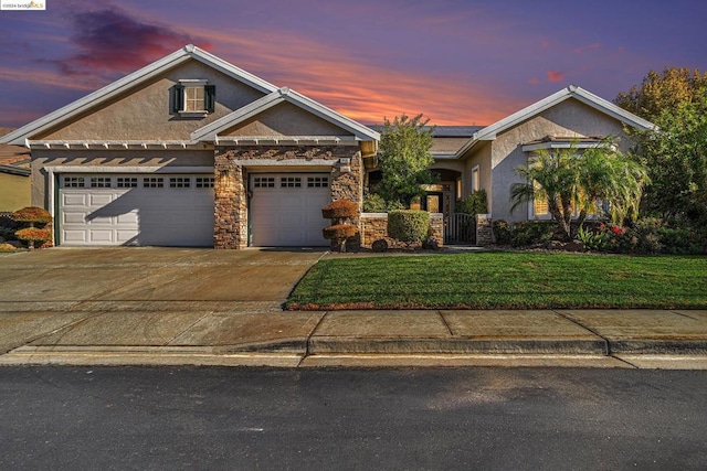 craftsman house with a garage and a yard