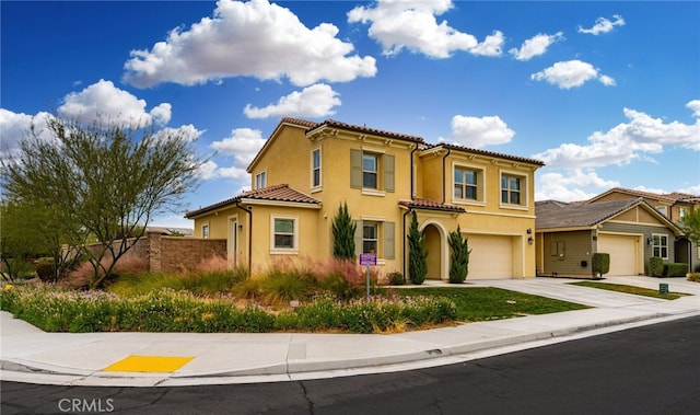 mediterranean / spanish-style home featuring a garage