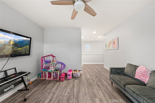 recreation room featuring hardwood / wood-style flooring and ceiling fan