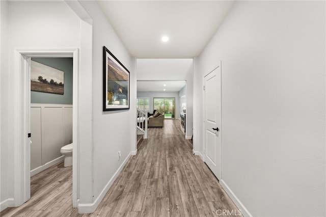 hall with light hardwood / wood-style flooring