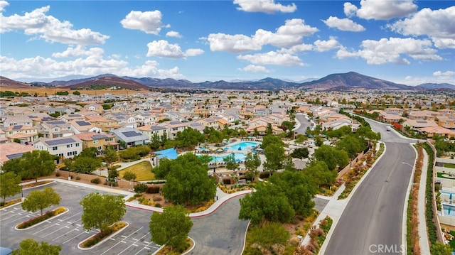 birds eye view of property featuring a mountain view