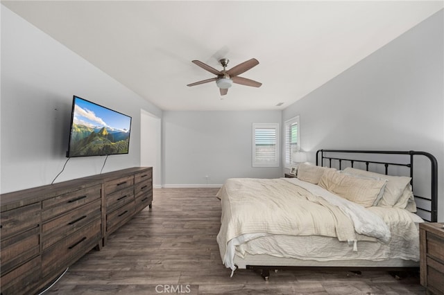 bedroom with ceiling fan and dark hardwood / wood-style floors