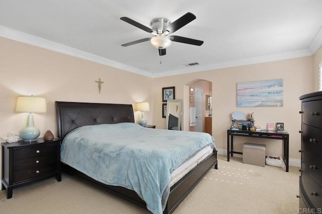 carpeted bedroom featuring ceiling fan and ornamental molding