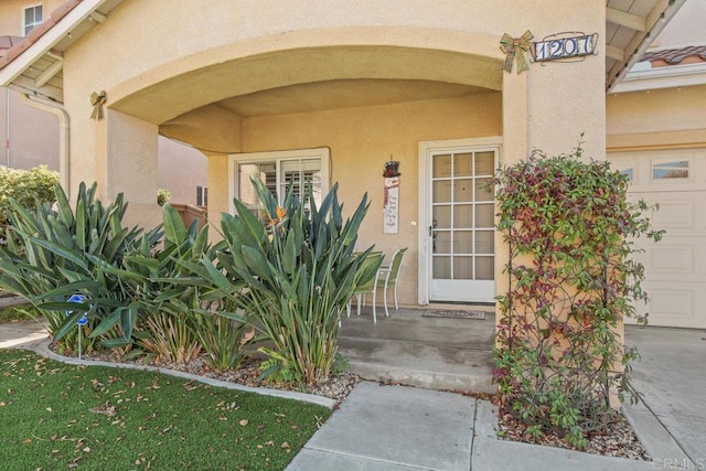 entrance to property featuring a garage