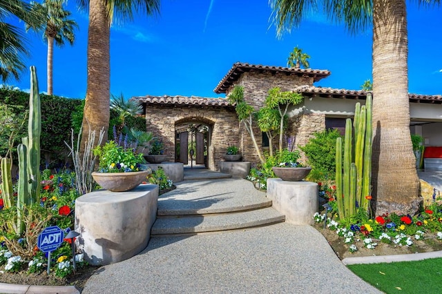 mediterranean / spanish-style house featuring french doors