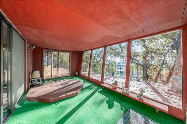 sunroom / solarium featuring wooden ceiling