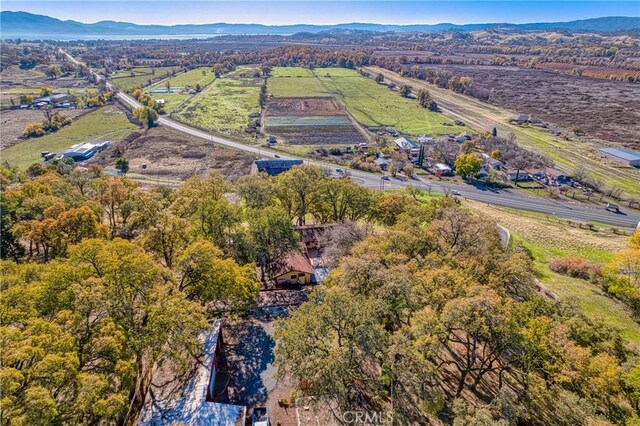 drone / aerial view featuring a mountain view