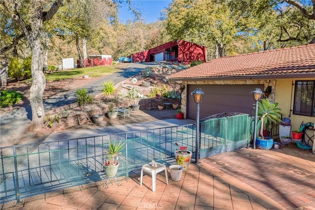 exterior space with an outbuilding and a patio
