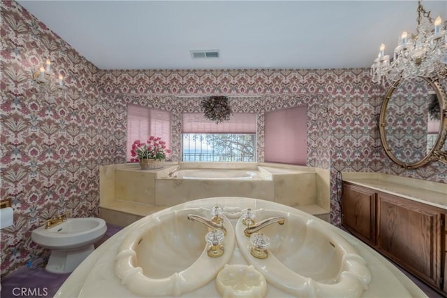 full bathroom featuring visible vents, a notable chandelier, a bidet, wallpapered walls, and a bath