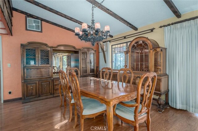 dining space with vaulted ceiling with beams, hardwood / wood-style floors, and a notable chandelier