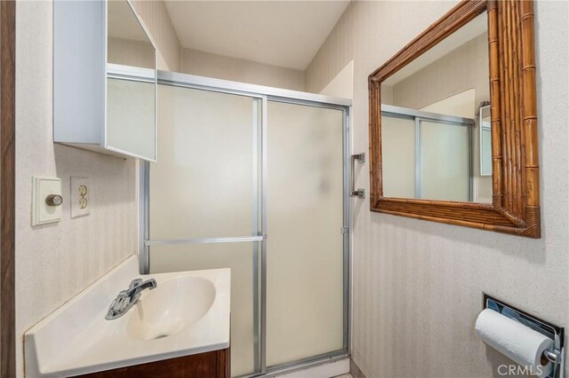 bathroom with vanity and an enclosed shower