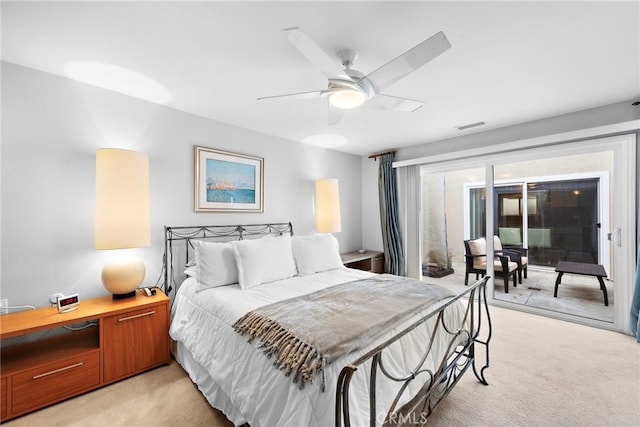 bedroom featuring ceiling fan and light carpet