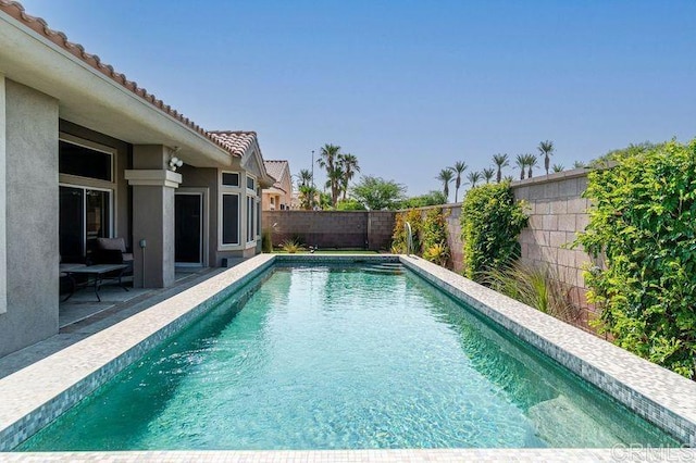 view of swimming pool featuring a patio