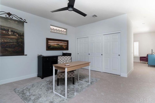 office area featuring ceiling fan, carpet flooring, visible vents, and baseboards