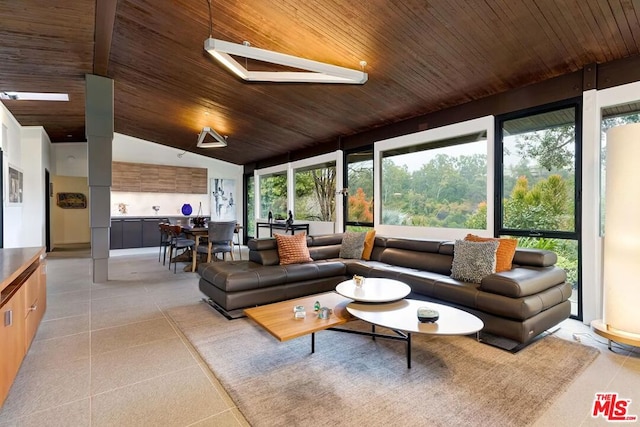 sunroom featuring vaulted ceiling