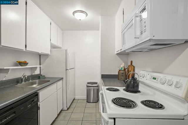 kitchen with light tile patterned floors, sink, white cabinets, and white appliances