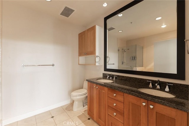 700 W Harbor Dr Unit 104, San Diego, CA 92101 - bathroom featuring double vanity, a shower stall, tile patterned flooring, and recessed lighting