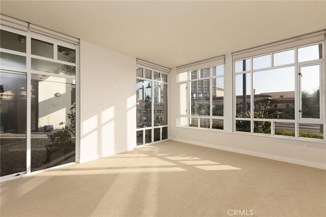 700 W Harbor Dr Unit 104, San Diego, CA 92101 - unfurnished sunroom with carpet flooring and baseboards
