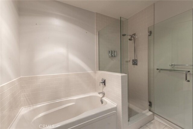 700 W Harbor Dr Unit 104, San Diego, CA 92101 - full bath with a bath, a shower stall, and tile patterned floors