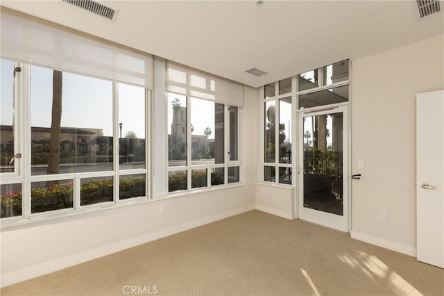 700 W Harbor Dr Unit 104, San Diego, CA 92101 - unfurnished sunroom featuring carpet and baseboards