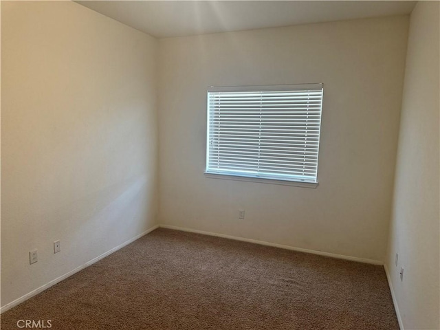 empty room featuring carpet flooring