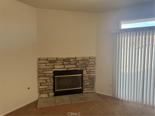 details featuring carpet and a stone fireplace