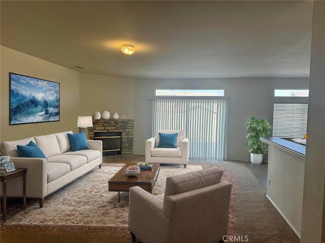 carpeted living room with a fireplace