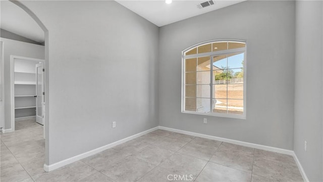 spare room with light tile patterned floors