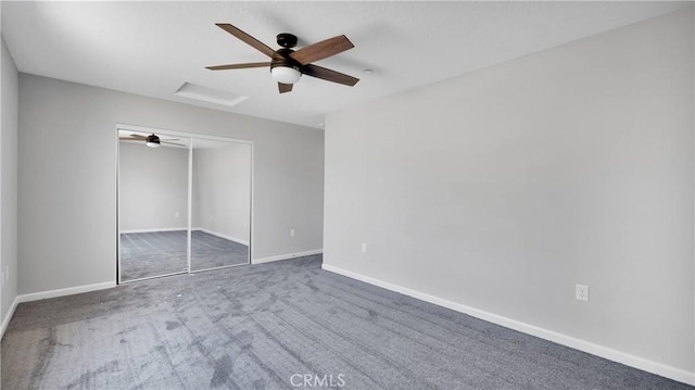 unfurnished bedroom with ceiling fan, carpet floors, and a closet