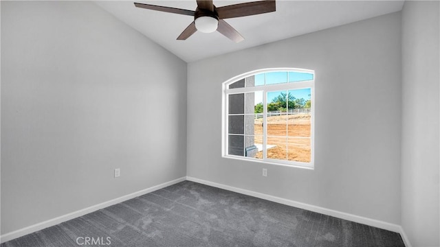 carpeted empty room with ceiling fan and vaulted ceiling