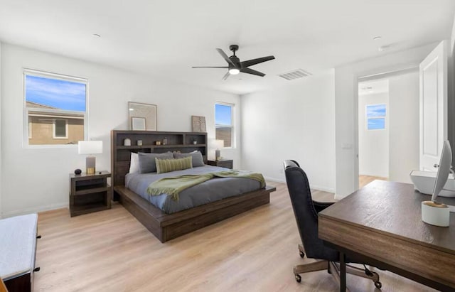 bedroom featuring light hardwood / wood-style floors and ceiling fan