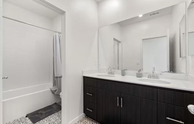 full bathroom featuring tile patterned flooring, vanity, toilet, and shower / bathtub combination with curtain