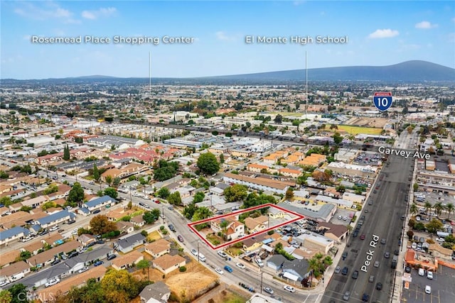 drone / aerial view featuring a mountain view