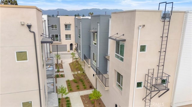 view of building exterior featuring a mountain view