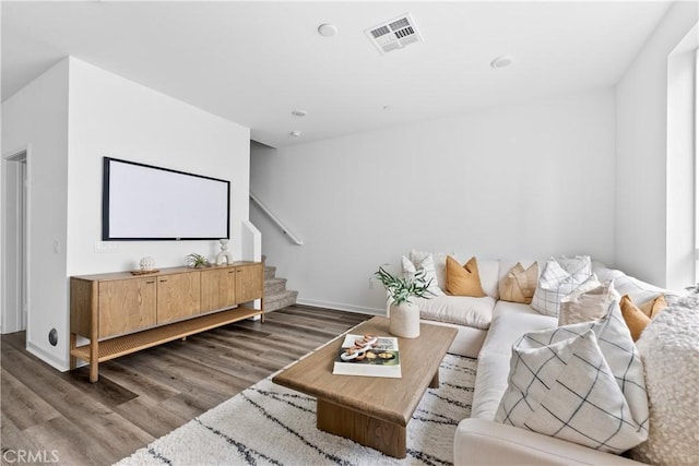 home theater room featuring dark wood-type flooring