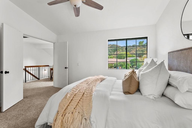 carpeted bedroom featuring ceiling fan and lofted ceiling