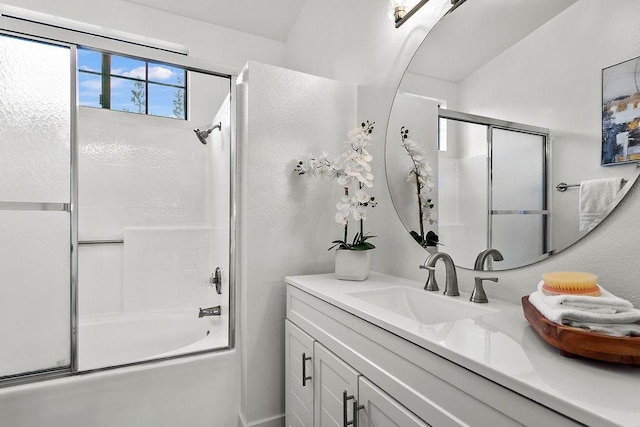 bathroom with vanity and bath / shower combo with glass door