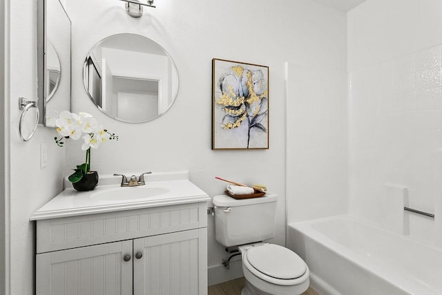 full bathroom featuring hardwood / wood-style floors, vanity, bathing tub / shower combination, and toilet