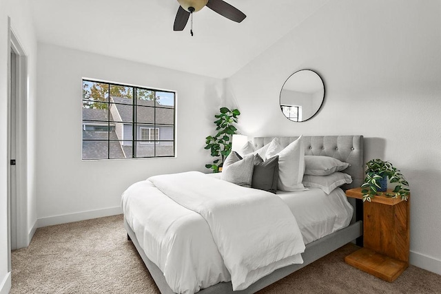 bedroom featuring carpet, ceiling fan, and lofted ceiling