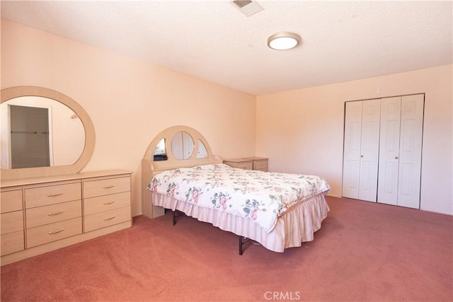 carpeted bedroom featuring a closet