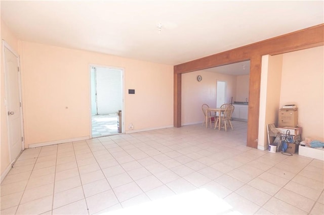 spare room featuring light tile patterned floors