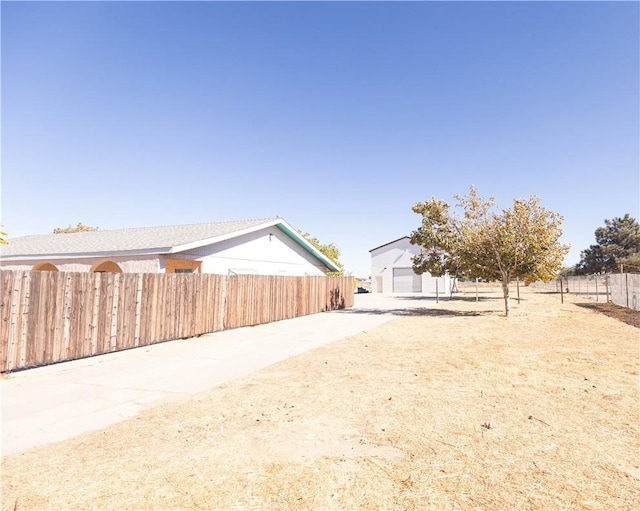 view of yard featuring a garage