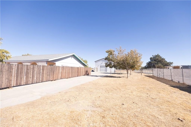 view of yard featuring a garage