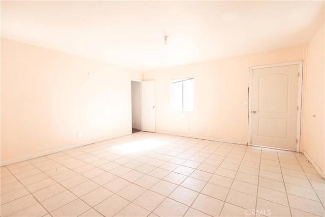 empty room with light tile patterned floors