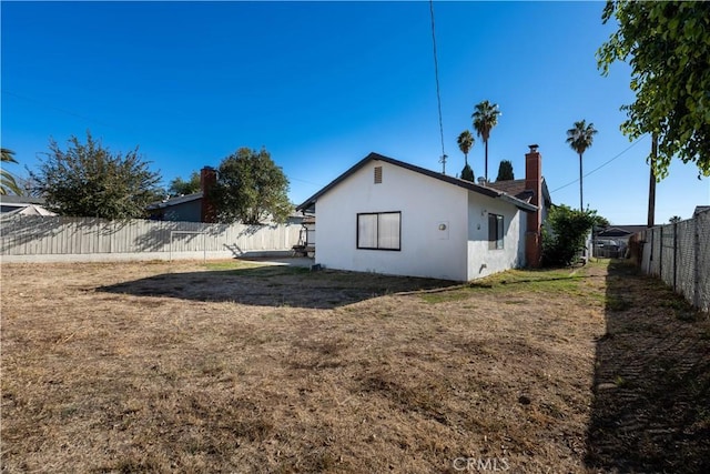 view of home's exterior with a yard