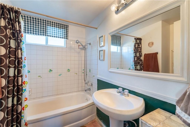 bathroom with sink and shower / tub combo with curtain