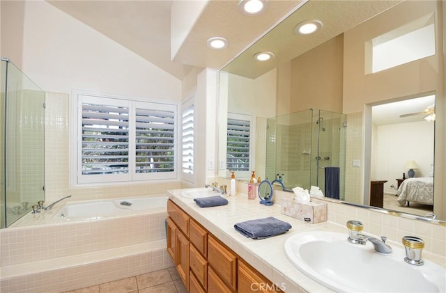 bathroom featuring vanity, tile patterned floors, vaulted ceiling, ceiling fan, and separate shower and tub